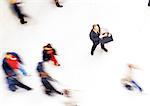 Businessman in crowd, elevated view, blurred