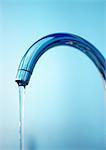 Faucet with running water, close-up