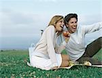 Young man and young woman having picnic