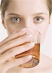 Woman drinking tea, close-up