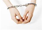 Handcuffed woman, close-up of hands