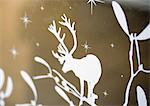 White reindeer silhouette on gold background