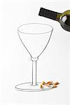 Wine bottle over drawing of wine glass, peanuts scattered at base