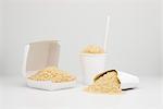Food concept, uncooked rice inside fast food containers