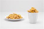 Food concept, cereal filling bowl and glass