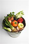 Bucket filled with assorted fresh vegetables