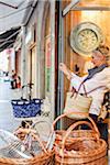 Woman Taking Photograph from Shop