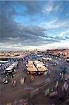 View over Djemaa el Fna at dusk with foodstalls and crowds of people, Marrakech, Morocco, North Africa, Africa