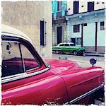 Street corner with red and green classic American cars, Havana Centro, Havana, Cuba, West Indies, Central America