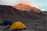 Tents at Plaza de Mulas base camp, with sunset on Aconcagua 6962m, highest peak in South America, Aconcagua Provincial Park, Andes mountains, Argentina, South America