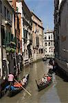 Gondolas passing in a narrow canal in Venice, UNESCO World Heritage Site, Veneto, Italy, Europe