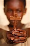 Young African Christian holding a cross, Lome, Togo, West Africa, Africa