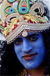 Man impersonating Hindu god Krishna at Janmashtami festival at Bhaktivedanta Manor ISKCON (Hare Krishna) temple, Watford, Hertfordshire, England, United Kingdom, Europe