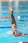 Young Woman Swimming in Pool