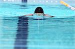 Young Man Swimming Breaststroke