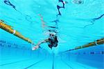 Woman Swimming in Pool, Underwater