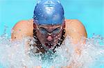 Young Man Swimming Breaststroke, Close-Up View