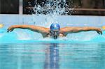 Young Man Swimming Butterfly