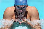 Young Man Swimming Breaststroke