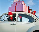 Family car with presents balanced on the roof