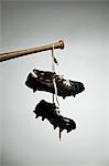 Shoes hanging from baseball bat