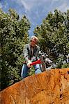 Low angle view of man chopping wood