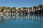 Rooms with verandas overlook a palm fringed swimming pool within the Royal Savoy Resort at Sharm el-Sheikh, Egypt, North Africa, Africa