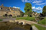 River Eye flowing through the pretty village of Lower Slaughter, the Cotswolds, Gloucestershire, England, United Kingdom, Europe