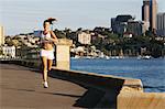 Young Woman Running Near Waterfront