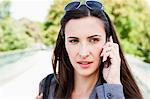 Businesswoman using cell phone outdoors