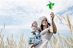 Woman holding pinwheel for daughter