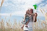 Woman holding pinwheel for daughter