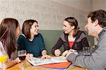 Students studying together in cafe