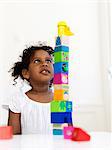 Girl building tower out of bocks