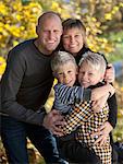 Portrait of family spending time together in park