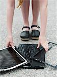 Girl with broken laptop