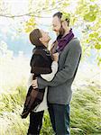 Young couple embracing under tree