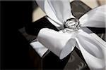 Wedding Rings on White Satin Bow