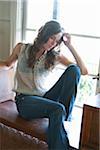 Portrait of Woman Sitting on Window Bench