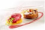 Small apple and almond Clafoutis,raspberry sorbet on sliced mango