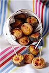 Small bacon and cheese flaky rolls with sesame and poppyseeds