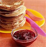 Stacked pancakes with strawberry jam