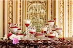 Dishes of panacotta and strawberry puree in a luxurious decor