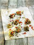 Oven-baked artichokes with Guindilla peppers and herbs