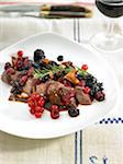 Hare backbone with summer fruit,red wine sauce and rosemary