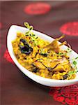 Rabbit with saffron rice and black trumpet mushrooms