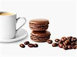 Chocolate macaroons,coffee beans and a cup of coffee