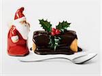 Christmas chocolate individual log cake with a Santa Claus figurine