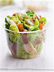 Caesar salad in a plastic container