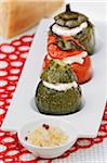 Round zucchini,tomato and green bell pepper stuffed with cheese